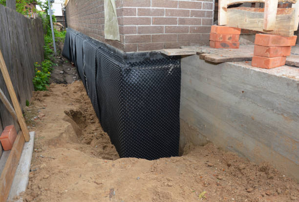 Happy homeowners after waterproofing job in East Hanover